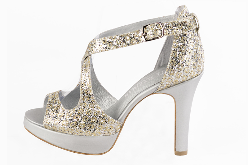 Gold women's closed back sandals, with crossed straps. Round toe. Very high slim heel with a platform at the front. Profile view - Florence KOOIJMAN
